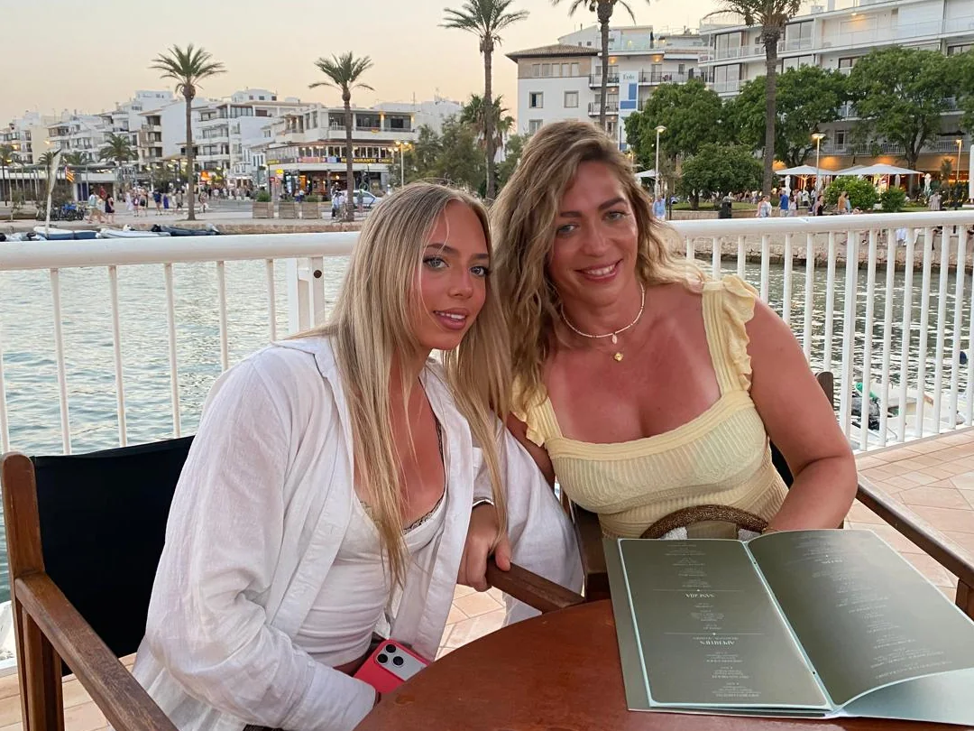 Alexa and her mum at a harbourside table