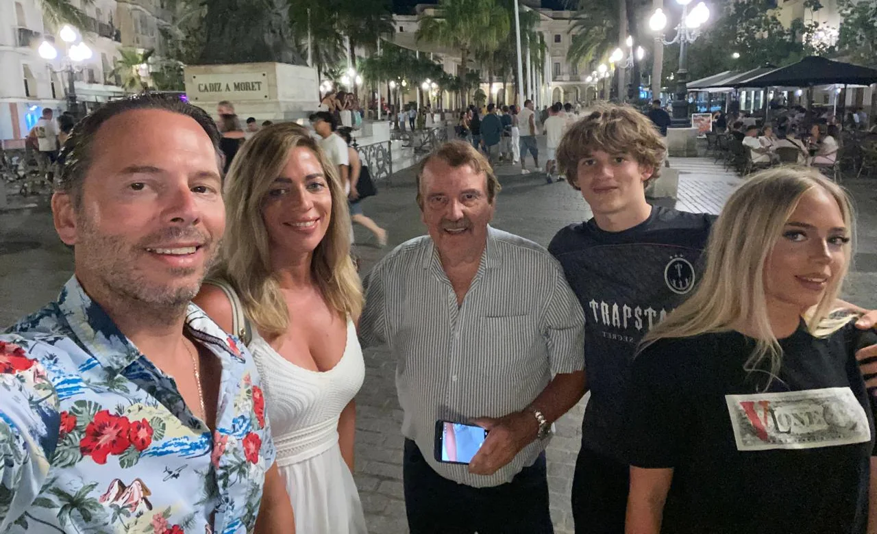 Dad, Mum, Grandad, Harry and Alexa in a town square at night