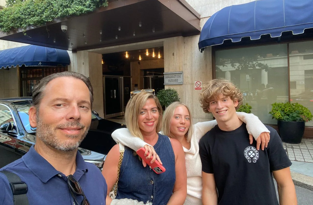 Harry, Mum and Dad outside a hotel